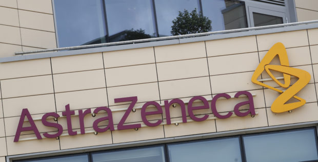 FILE - This Saturday, July 18, 2020 file photo shows a general view of AstraZeneca offices and the corporate logo in Cambridge, England.