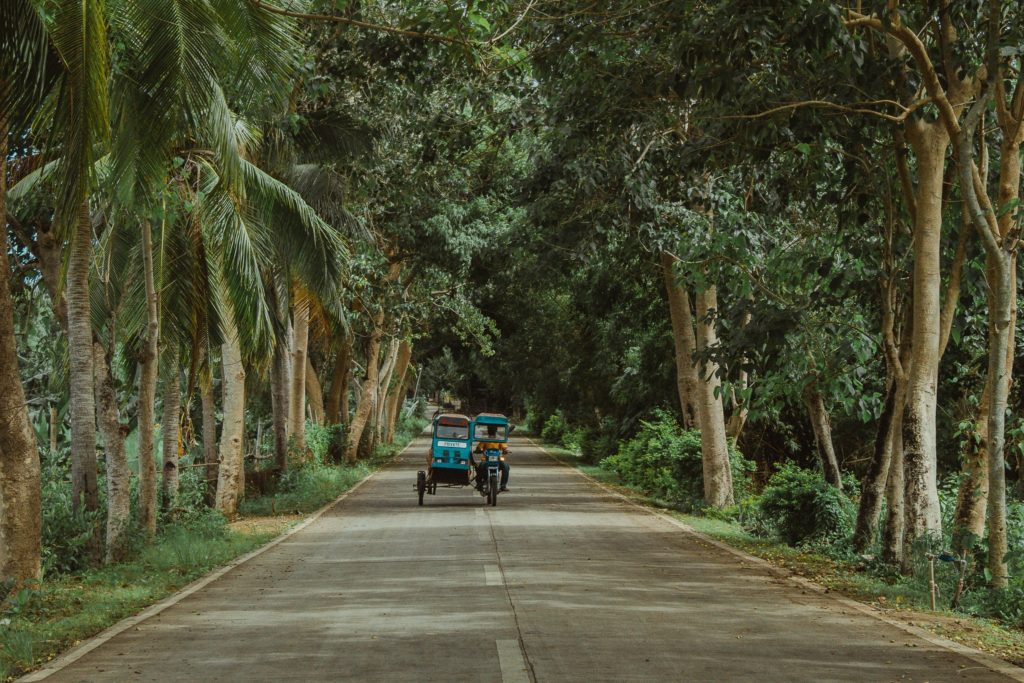 Bantayan Island is perfect for photo opportunities such as this near empty road lined with trees on both sides. | Photo courtesy of Kent John Batiancila