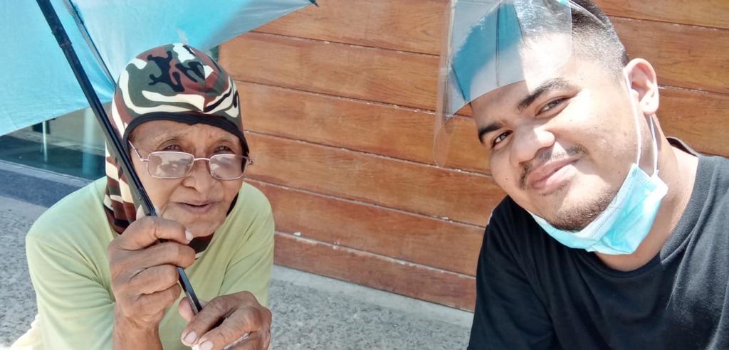An elderly woman, Lola Berna, sells candies under the heat of the sun to raise money for the rent of a room she was staying in. | contributed