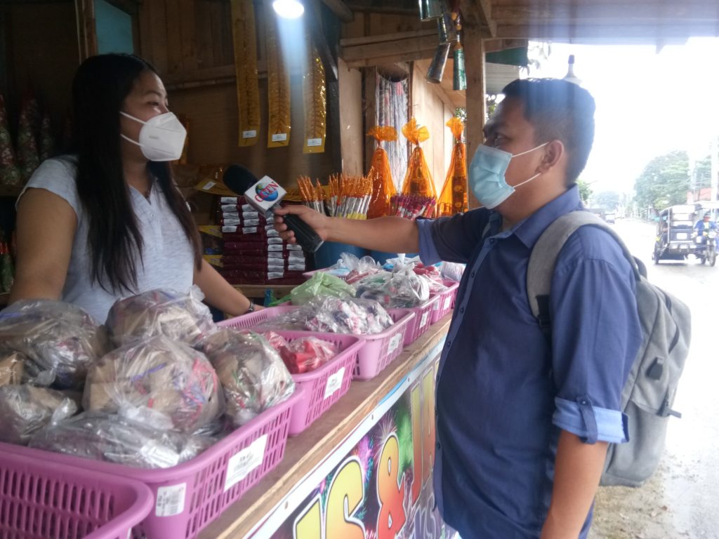 CDN Correspondent Futch Anthony Inso interviews one of the firecracker vendors in Lapu-Lapu City. | Futch Anthony Inso