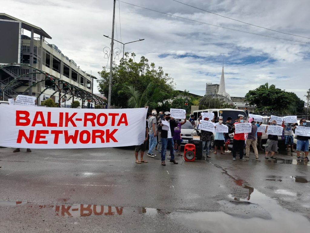 Members of the tricycle drivers' group Balik Rota Network hold a rally in front of the Mandaue City Hall on Monday, January 11, 2021. | Mary Rose Sagarino