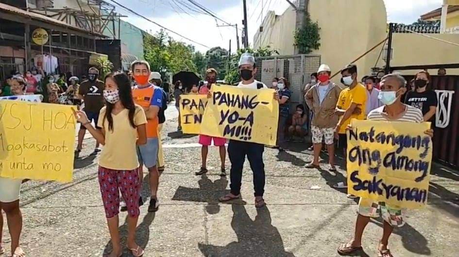 Residents of Purok 2, Barangay San Jose, Cebu City are appealing to owners of a subdivision to let them use the subdivision road for six months -- enough time for a diversion road for the Purok to be completed. | Delta Dyrecka Letigio