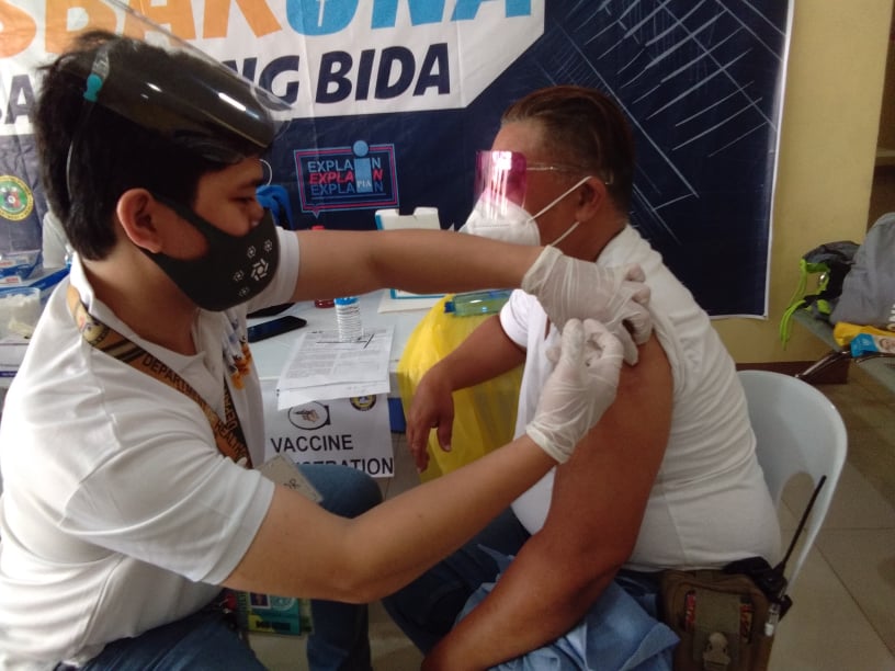 MANDAUE CITY PIO SAYS 50% OF TARGET POPULATION IS FULLY VACCINATED. In photo, one of Mandaue City's frontliners gets a vaccine shot at a vaccination center in the city in this March 2021 photo. | CDN Digital file photo