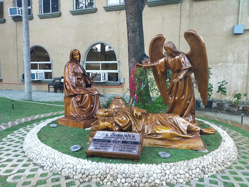 This is part of the life-size statues in the Jardim de Sao Jose or the Garden of St. Joseph depicting The doubt of Joseph and the Annunciation of the Angel Gabriel to Mary.