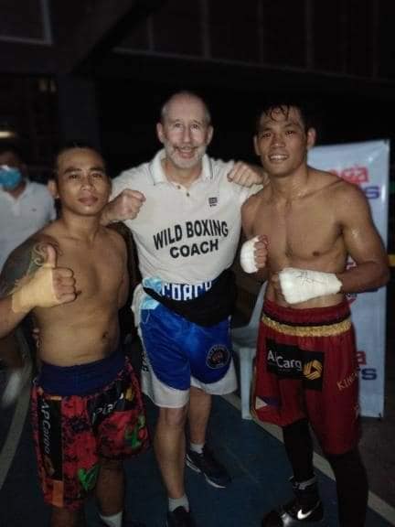 Mark Barriga (left) and Arthur Villanueva (right) get confidence boosting wins at the ‘Kumbati 8 & 9’. John Wild (center), their boxing trainer, poses with them in this photo. | Photo from Arthur Villanueva’s FB account
