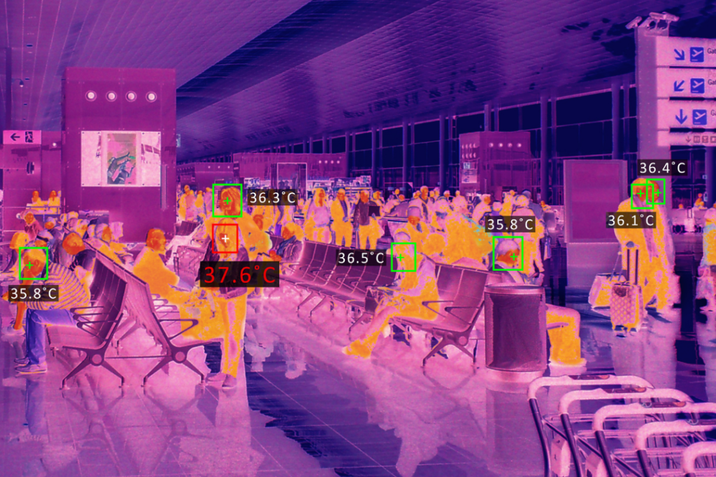A photo of people under a thermal scanner