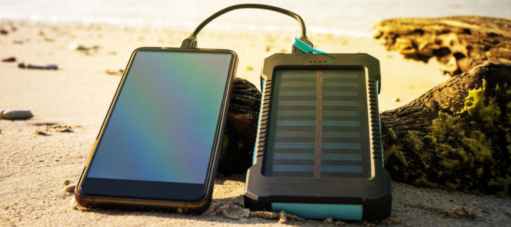 A photo of a solar charger charging a mobile device. 