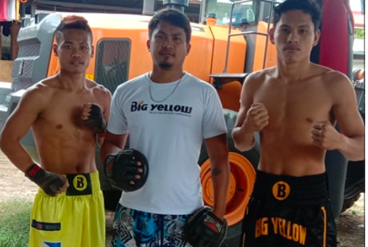 Big Yellow Boxing Gym's chief trainer Christopher "Ping-ping" Tepora is flanked by his boxers Reycar Auxilio (left) and Allan Villanueva (right).