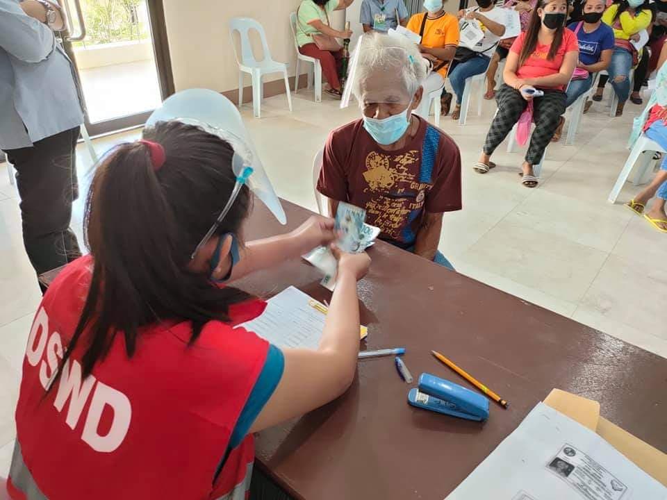 Senior citizens, who are beneficiaries of the Department of Social Welfare and Development in Central Visayas' social pension, receive their P3,000 pension covering the months of January to June this year. | Photo courtesy of DSWD-7
