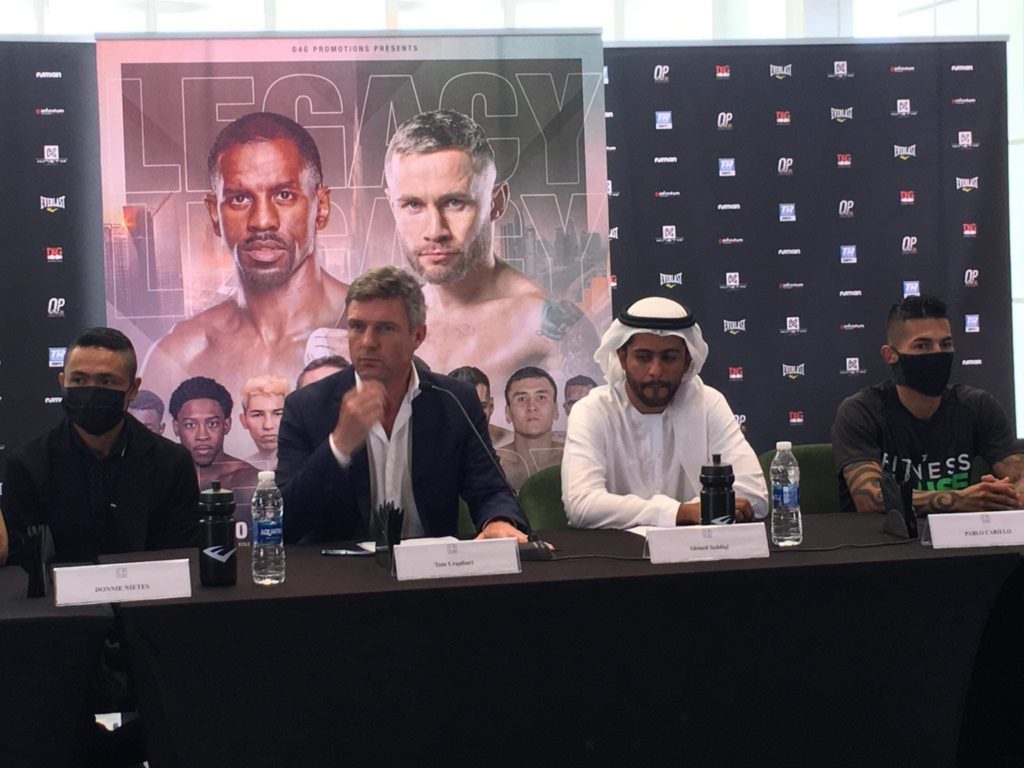 Donnie Nietes (extreme left) and Pablo Carillo (extreme right) flanks the promoters Tom Urquhart and Ahmen Seddiqi during the final presser of their WBO international super flyweight title at the Caesar's Palace in Dubai, UAE