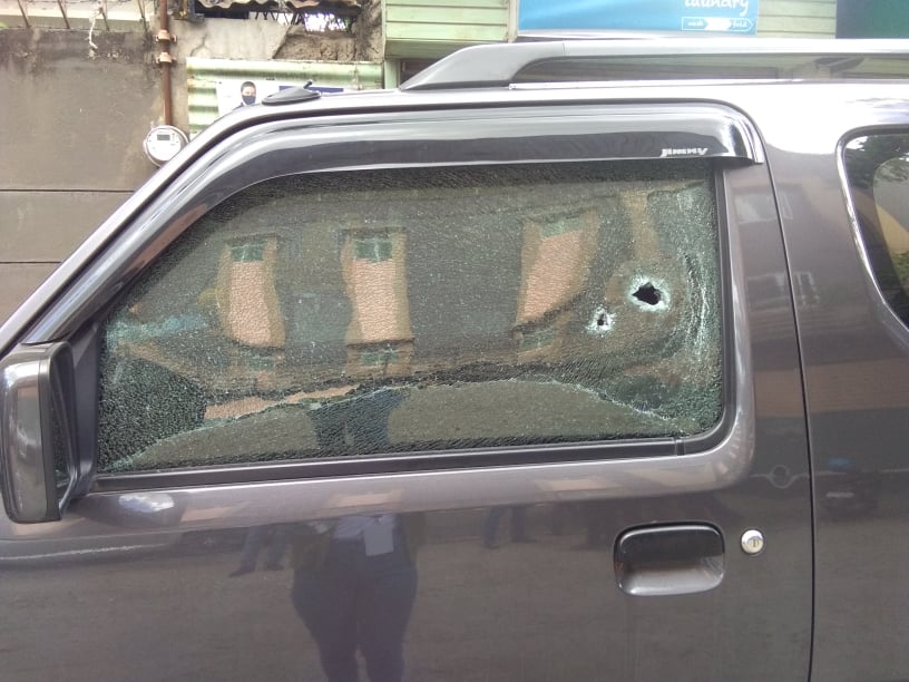 Bullet holes are seen on the left window of a car after a female Korean national was shot and wounded by an unidentified assailant in Barangay Banilad, Mandaue City at past 9 a.m. today, April 12. | Mary Rose Sagarino 