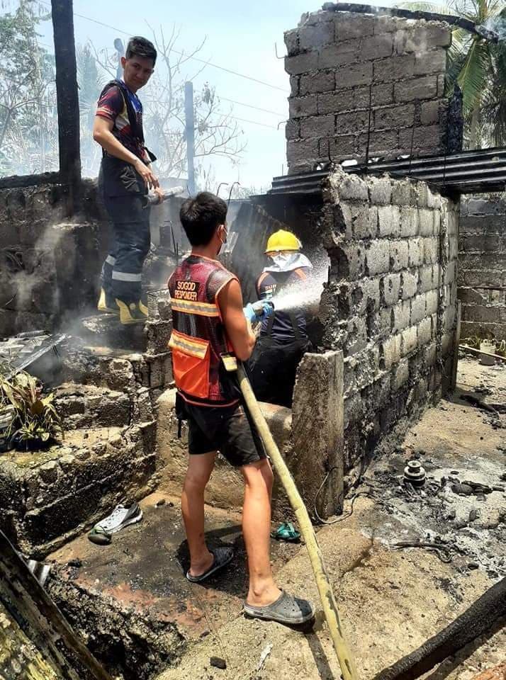 SOGOD fire: Firefighters make sure that the fire that razed a house in Villa Monina, Barangay Bagatayam in Sogod town, northern Cebu is really out.| Photo from Sogod MDRRMO