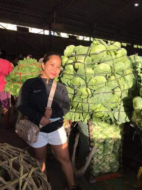 SAN FERNANDO COMMUNITY PANTRY. Maria Gracia, who set up the San Fernando community pantry, buys the kilos of unsold cabbage from Mantalongon farmers in Dalaguete town. 