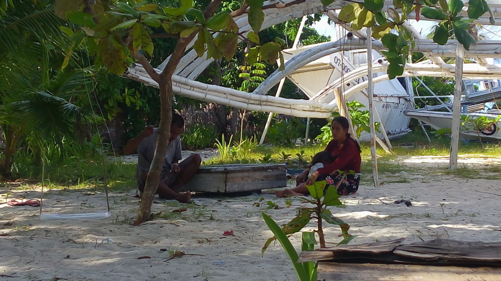 A fisherman in the island is fixing the "kitang" that he would use in fishing. | Doris Bongcac