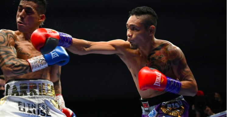 Donnie “Ahas” Nietes connects a right straight to his opponent Pablo Carillo during their WBO International Super Flyweight bout at the Caesar's Palace Rotunda in Dubai UAE. | Photo courtesy of D4G Promotions