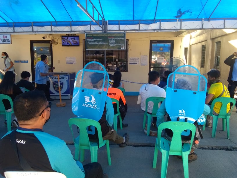 TEAM CLEARANCE: Angkas and Joyride drivers wait for their turn to pay for the clearance permit for them to operate in Mandaue City today at the Traffic Enforcement Agency in Mandaue (TEAM) office in Mandaue City today. | Mary Rose Sagarino