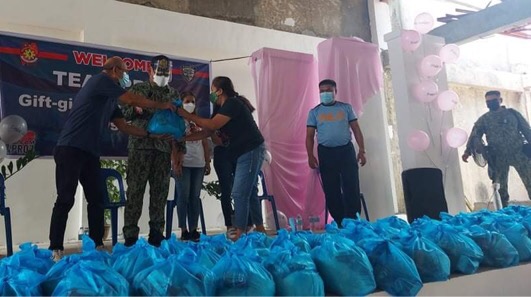 150 families receive gift packs from the regional policemen during their relief operations today in Barangay Bangkal, Lapu-Lapu City.