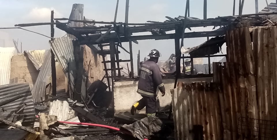 Cebu City firefighters make sure that the past noon Mother's day fire has already been put out in Sitio Seaside, Alumnos, Barangay Basak Nicolas, Cebu City. | Paul Lauro #CDNDigital