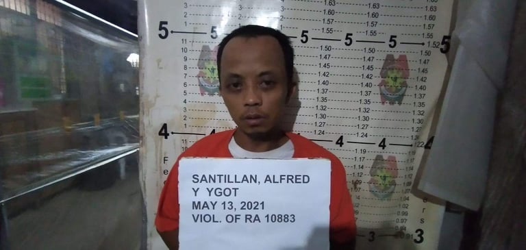 Alfred Santillan is being processed at the Tawason Police Station after his arrest in Barangay Talamban, Cebu City on Thursday, May 13. | Photo courtesy of Tawason Police Station
