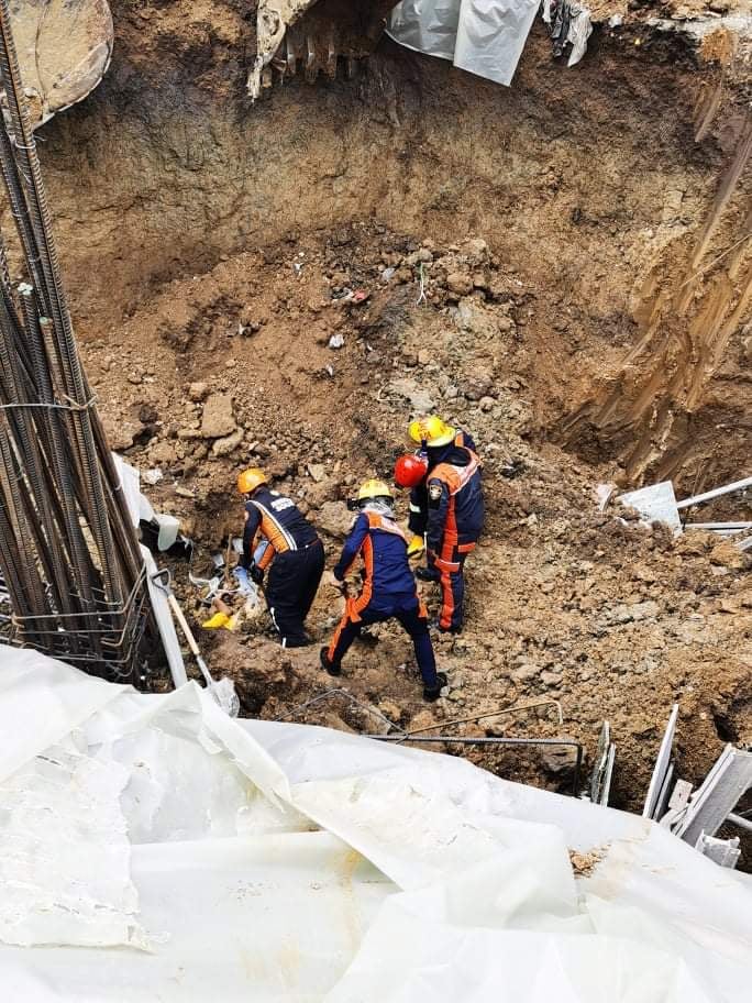 FIRM assures aid to workers, who died and got injured in project site accident. In photo are rescue personnel trying to retrieve one of the persons buried in the cave in at the site. 