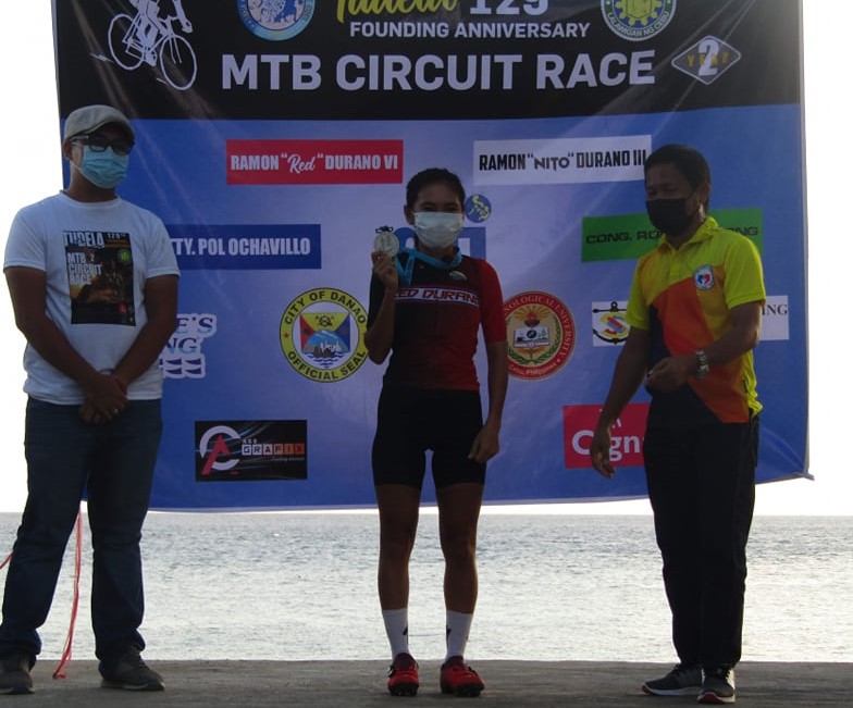 DANAO CYCLING TEAM'S  Shagne Yaoyao proudly shows her medal during the awarding ceremony of the Tudale MTB Circuit Race Year 2 on Sunday, May 16. | Photo from Sikista Tudela Photography