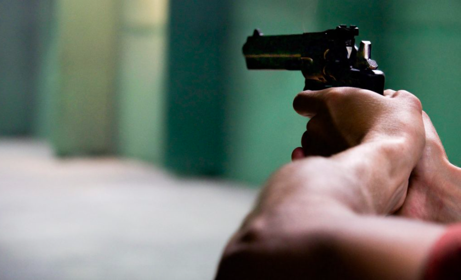 Tuburan shooting. This is a stock photo of a man aiming a hand gun.