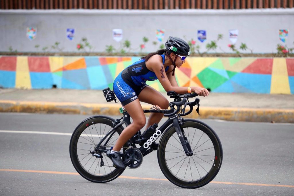 MOVE LILO-AN founder triathlete Katherine Jumapao rides her bike during one of her triathlon competitions.