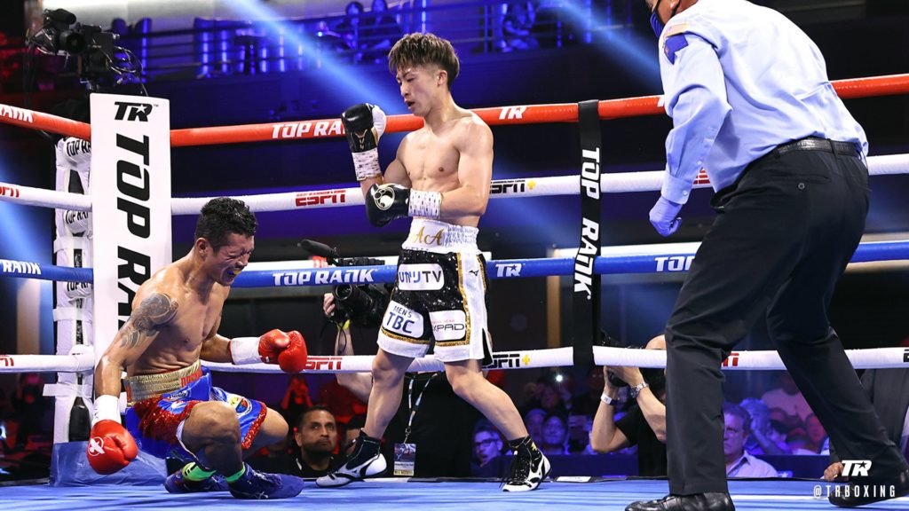 Filipino challenger Michael Dasmariñas grimaces in pain after getting knocked down by Japanese champion Naoya Inoue in the third title fight today in the U.S. | Photo from Top Rank Boxing.