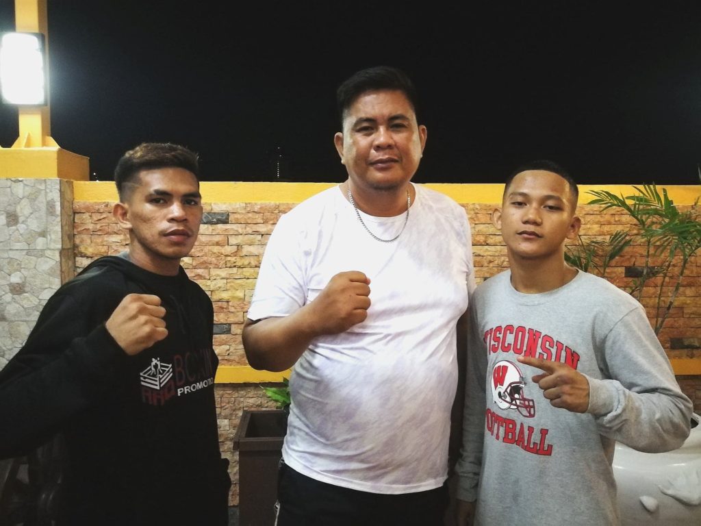 ARQ Boxing Boxer April Jay Abne (left), is with  ARQ sports director Chelito Caro (center), and Boxer John Paul Gabunilas. | CDN Digital file Photo