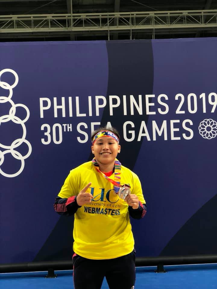 Cebuana weightlifter Elreen Anne Ando shows her medals during her stint at the 30th Southeast Asian Games. | Photo from Ando's FB page