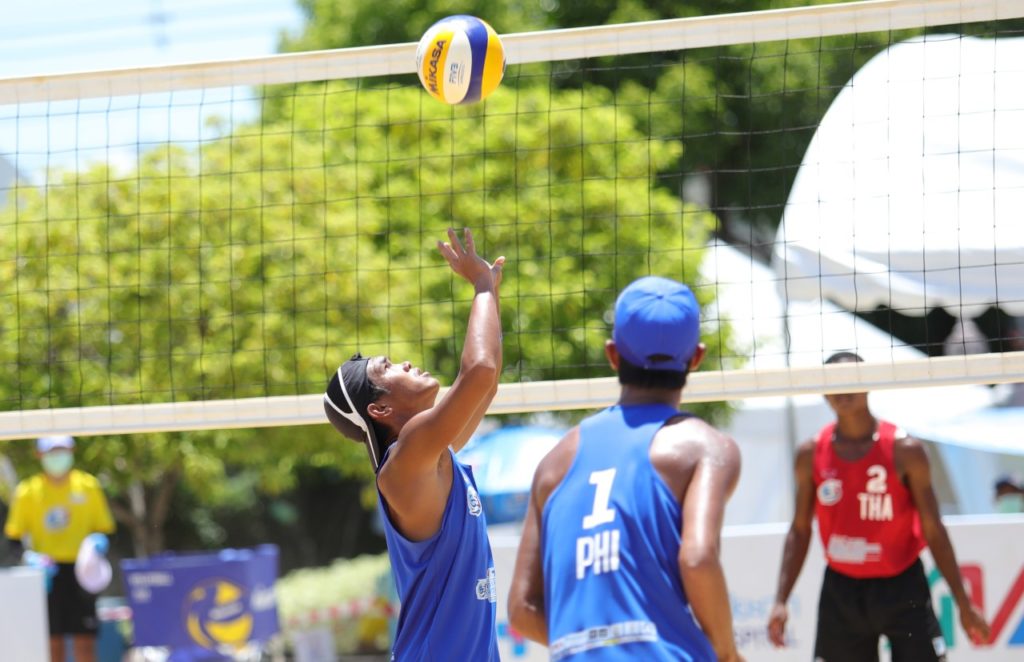 Alexander Iraya sets the ball as his teammate, Jayrack Dela Noche looks on during their match against Thailand team one in the ongoing Third Asian U19 Beach Volleyball tilt in Thailand. | Contributed Photo