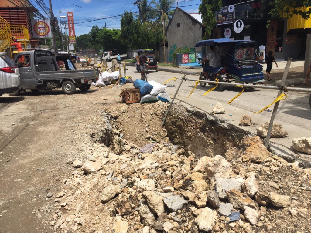 CONTRACTOR OF PROJECT CLAIMS WARNING DEVICES PLACED AT SITE. This is the excavation site for a drainage project in Barangay Pajac, Lapu-Lapu City where two vehicles fell into. | Futch Anthony Inso
