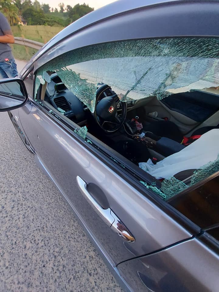 Carcar Shooting. The left side of the driver's window is shattered after this was shot by two still unidentified motorcycle-riding gunmen in Sitio Tangasan in Barangay Valladolid in Carcar City shortly before 6 p.m. today, July 11. | Photo courtesy of Arnulfo Apura