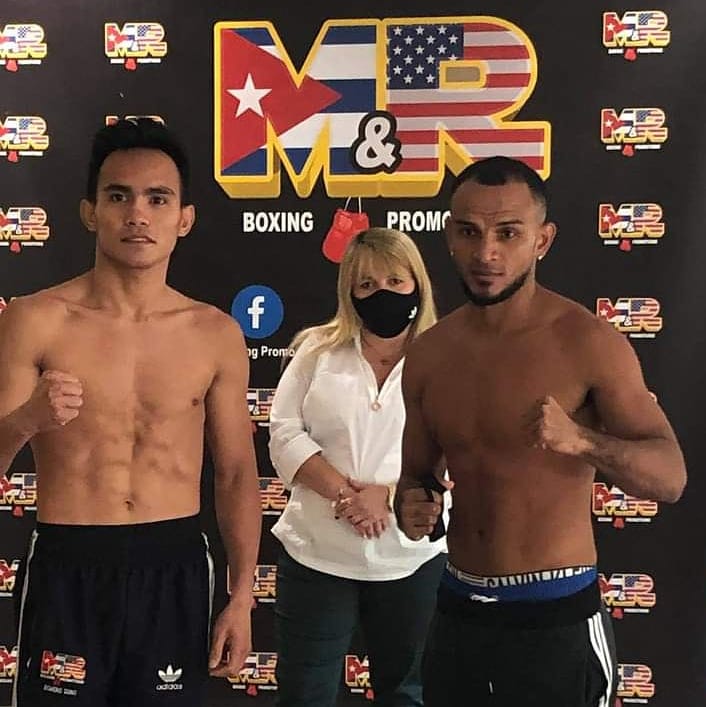 Duno makes weight for non-title bout with Colombian Perez. In photo are both fighters striking a pose after their weigh in for the Sept. 24 fight in Florida.