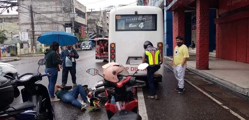 MOTORISTS URGED TO BE CAREFUL IN DRIVING TO AVOID ACCIDENTS. The passenger and the driver of a motorcycle suffer minor injuries after they figured in an accident with a minibus partly caused by the wet slippery road along Osmeña Boulevard in Cebu City on Thursday, September 2, 2021. | Contributed photo via Paul Lauro