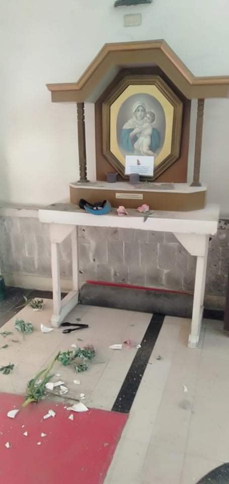 POLICE TRYING TO FIND OUT IF MAN IS MENTALLY CHALLENGED OR NOT. The man before throwing a stone at the image of the Sto. Niño at the National Shrine of St. Joseph allegedly broke a vase offered in front of the Virgin Mary. | Contributed photo