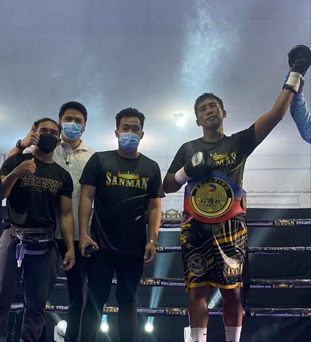 ABDULHAMID PUMMELS EGERA INTO SUBMISSION. Adam Diu Abdulhamid raises his hands with the Philippine welterweight title worn around his waist after defeating Jason Egera in the main event of Sanman Bubble VI in General Santos City on Friday, October 29. | Photo from Sanman Promotions.