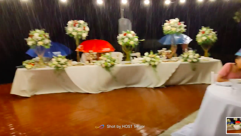 Rain fails to stop wedding reception.