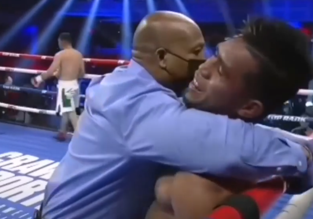 BERNALDEZ GETS TKOED IN 3RD. The bout's referee embraces Filipino boxer Mark Bernaldez after the former stopped the fight in the third round. | Screen grab during the fight's live streaming.