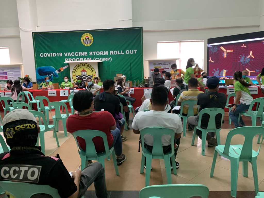 City Hall employees wait for their turn to get vaccinated at the pop-up vaccination site at the Cebu City Hall. | Delta Dyrecka Letigio