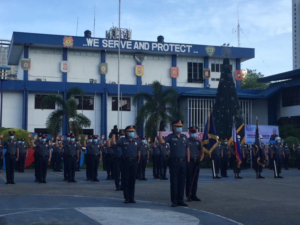 PRO-7 policemen attend the flag-raising ceremony at the PRO-7 headquarters.