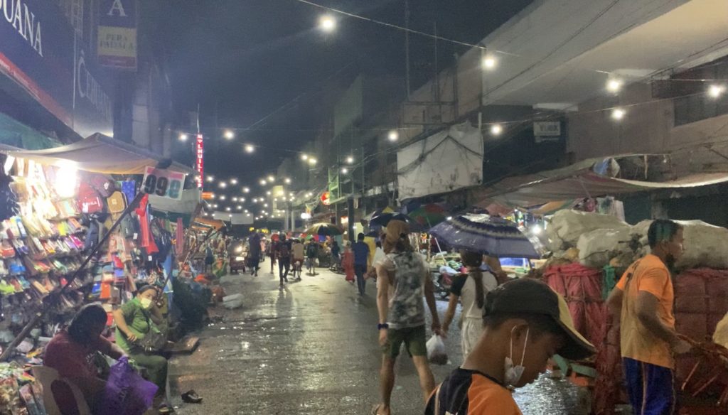  A series of lights adorn the area where a line of stalls are in the market signifying the start of the Pasko sa Carbon celebration. | Delta Dyrecka Letigio