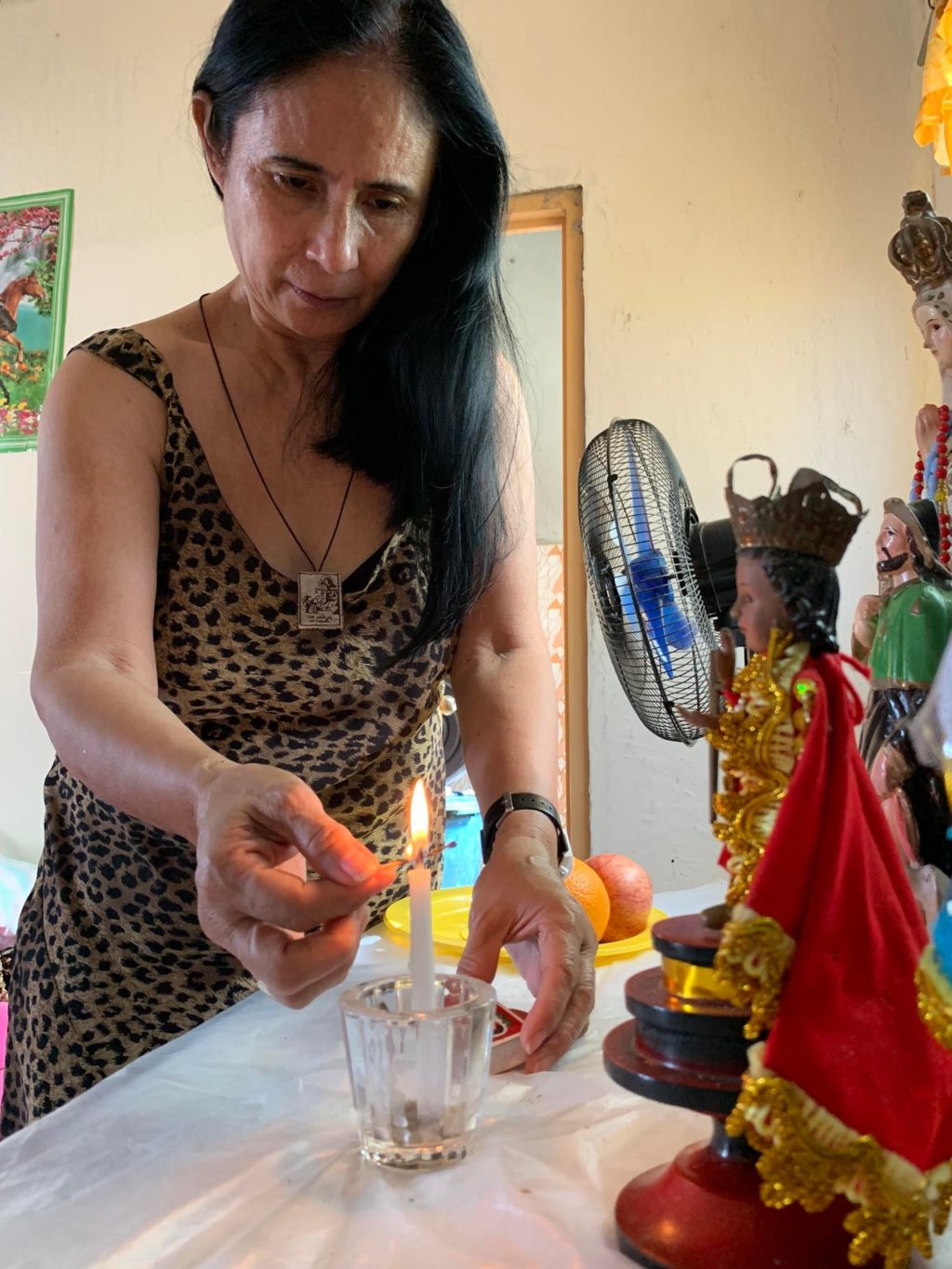 Devotee Rosanna Pangan celebrates the Fiesta Señor in her home in Medellin town in northern Cebu. | Doris Mondragon