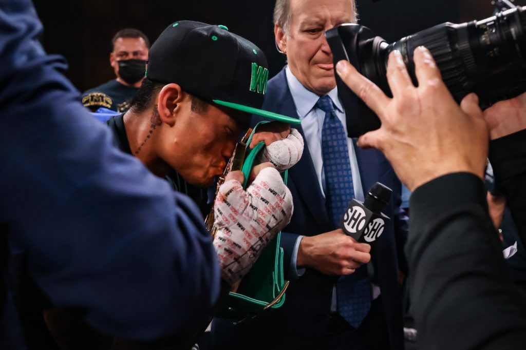 Mark Magsayo kisses the WBC world featherweight belt after dethroning Gary Russell Jr. via majority decision in Atlantic City, New Jersey. | Photo from Showtime Boxing's Twitter Account.