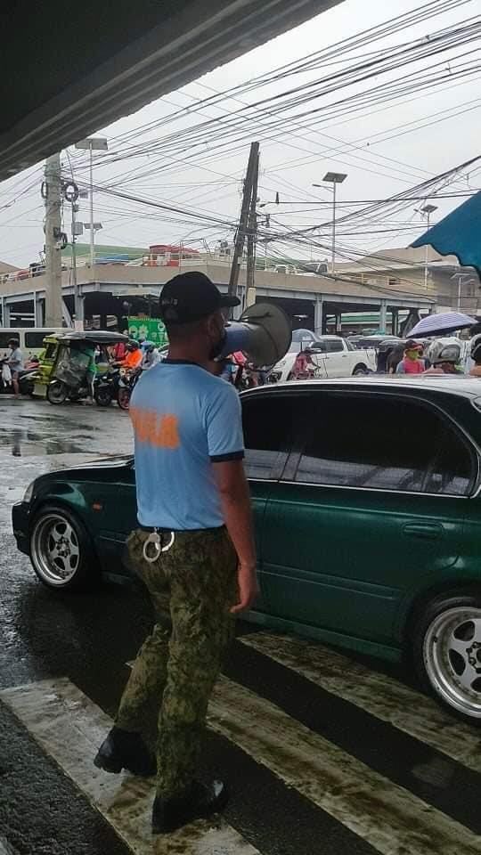 TALISAY COP CHIEF: INFO DRIVE ON FIRECRACKER BAN EFFECTIVE. In photo is a policeman conducting an info drive on the ban of firecrackers in one of the barangays of Talisay City. Photo courtesy of Kapulisan Talisay Katawhan FB page