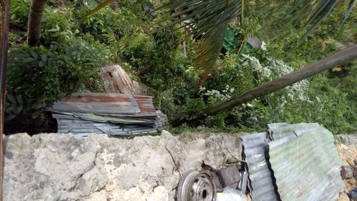 This is where the truck ended (far right of photo) after it fell from a cliff in Borbon town, Cebu. | Contributed photo