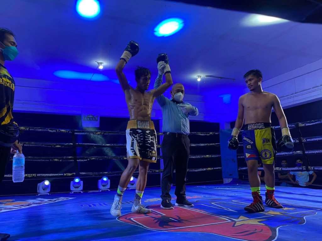 Dave Apolinario raises his hands after beating Mike Kinaadman in the main event of Sanman Bubble Boxing VII on Saturday in General Santos City. | Photo from Sanman Boxing Facebook page