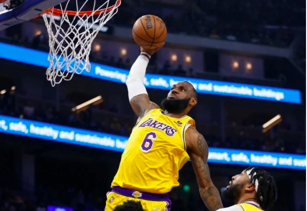 LeBron James #6 of the Los Angeles Lakers dunks the ball in the first half against the Golden State Warriors at Chase Center on February 12, 2022 in San Francisco, California. Lachlan Cunningham/Getty Images/AFP