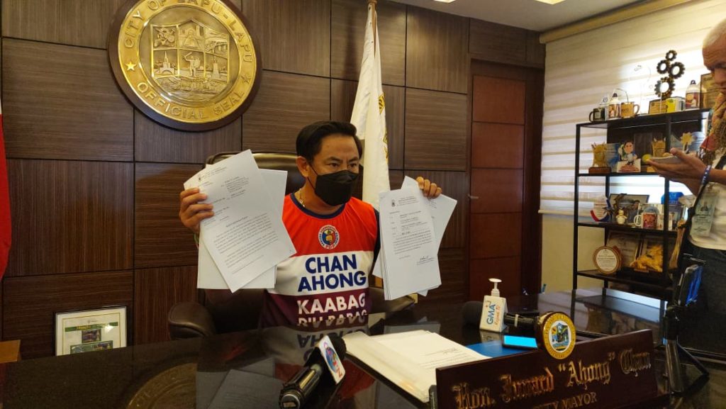 Ombudsman junks 4 complaints against Chan. Lapu-Lapu City Mayor Junard "Ahong" Chan shows the documents where the Ombudsman dismissed complaints filed against the mayor. | Futch Anthony Inso