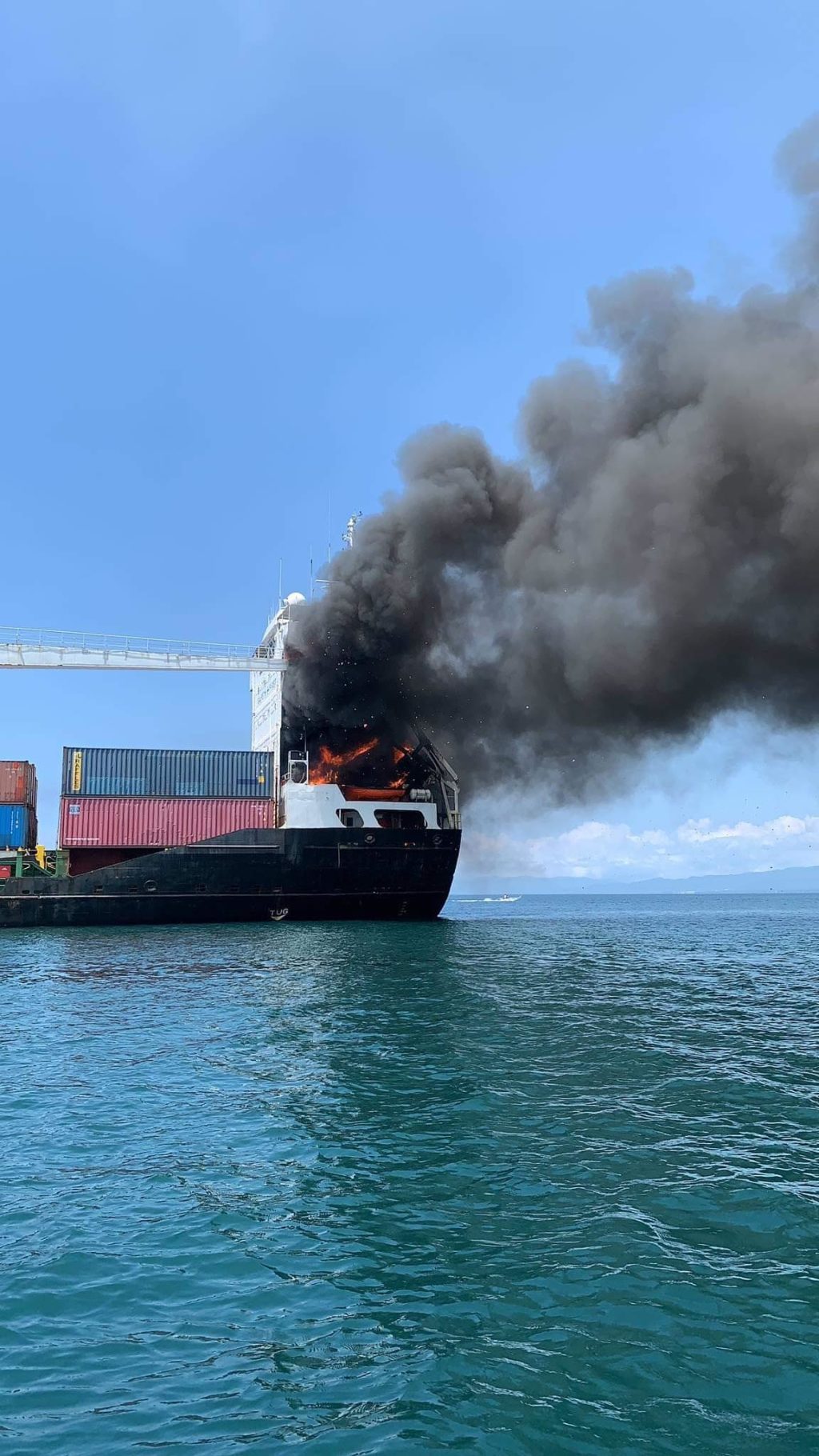 Authorities respond to a fire that hit a cargo vessel while sailing the coasts of Talisay City.